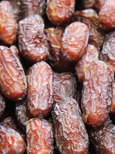 Dates fruits backgrounds. Pile of dates fruits in a shop