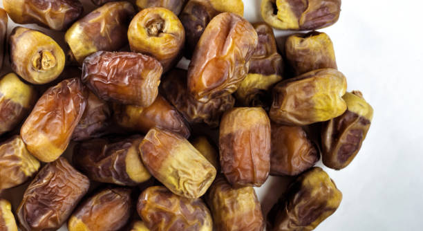 Top view of Dried dates on white background