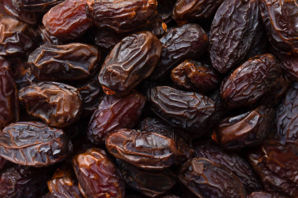 Heap of dried date fruits background