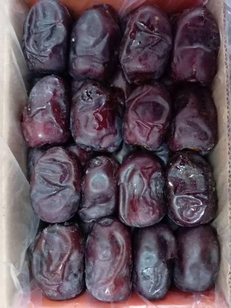 Dried date fruit in plastic box. Close-up. Top view.photo taken in malaysia