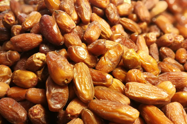Palm dates : fresh date fruits as background