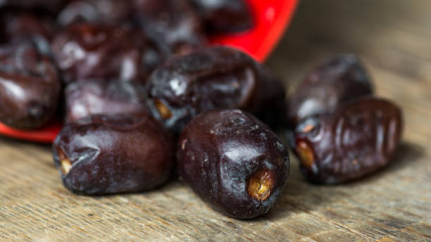 Dates on wooden background